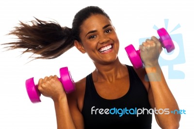 Happy Fitness Woman Lifting Dumbbells Stock Photo