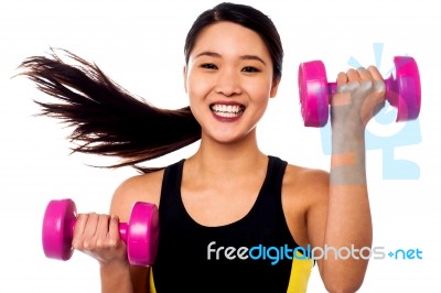 Happy Fitness Woman Lifting Dumbbells Stock Photo