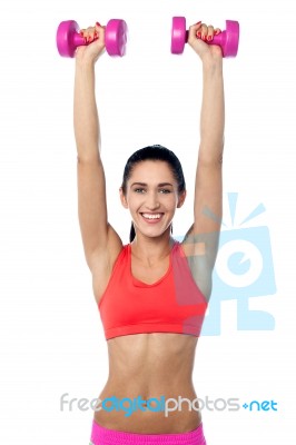 Happy Fitness Woman Lifting Dumbbells Stock Photo