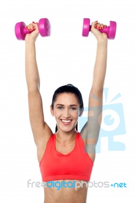 Happy Fitness Woman Lifting Dumbbells Stock Photo