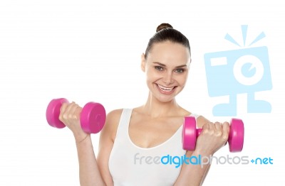 Happy Fitness Woman Lifting Dumbbells Stock Photo