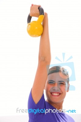 Happy Fitness Woman Lifting Kettlebell Stock Photo