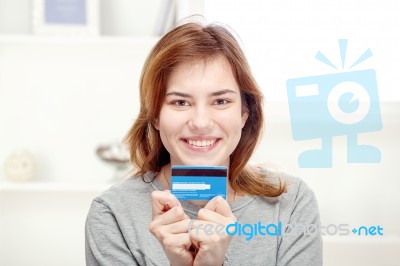 Happy Girl Holding Credit Card Stock Photo