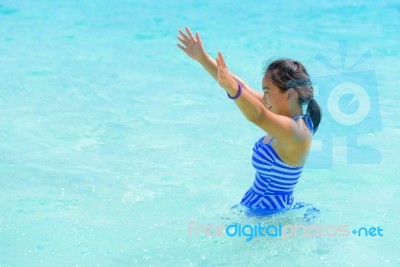 Happy Girl In The Sea Stock Photo