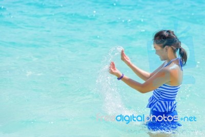 Happy Girl In The Sea Stock Photo