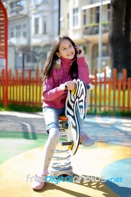 Happy Girl With Phone Stock Photo