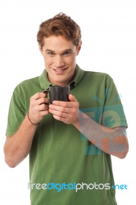 Happy Guy Enjoying Hot Beverage Stock Photo