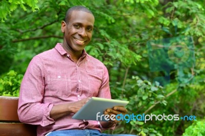 Happy Guy Using His Tablet Pc, Outdoors Stock Photo