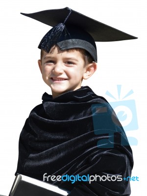 Happy Kid Graduate With Graduation Cap Stock Photo