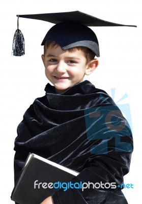 Happy Kid Graduate With Graduation Cap Stock Photo