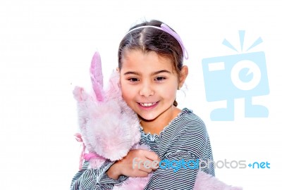 Happy Little Girl Holding Pink Unicorn Toy Isolated On White Stock Photo