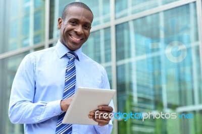 Happy Male Executive Posing To Camera Stock Photo