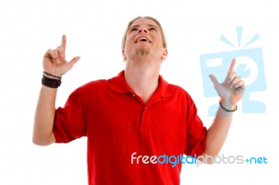 Happy Male Pointing With Both Hands Stock Photo