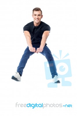 Happy Man Jumping In Air Stock Photo