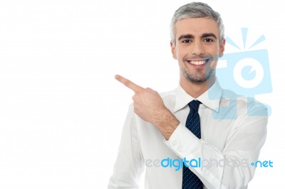 Happy Man Pointing At Something Stock Photo