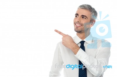 Happy Man Pointing At Something Stock Photo