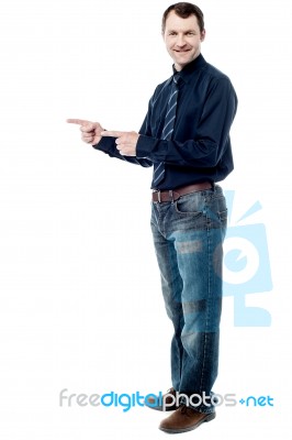 Happy Man Pointing At Something Stock Photo