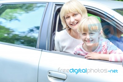 Happy Mother And Daughter In Car Stock Photo