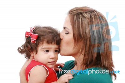 Happy Mother Kissing Her Daughter, Isolated On White Background Stock Photo