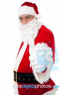 Happy Santa Showing Thumbs Up To Camera Stock Photo