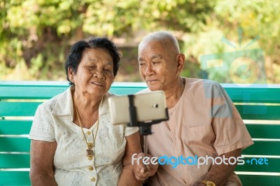 Happy Senior Couple Posing For A Selfie Stock Photo