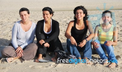 Happy Sisters At The Beach Stock Photo