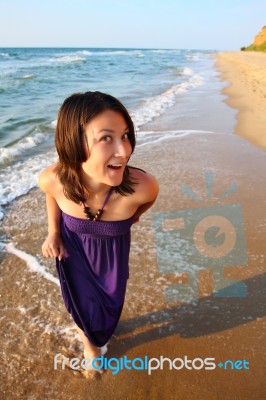 Happy Smiling Girl On The Beach Stock Photo