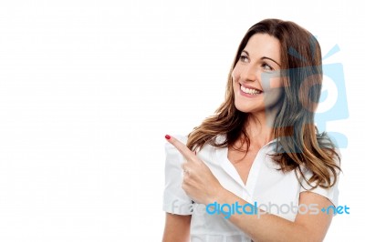 Happy Smiling Woman Showing Copyspace Stock Photo