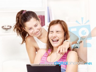 Happy Teenage Girls Using Touchpad Stock Photo