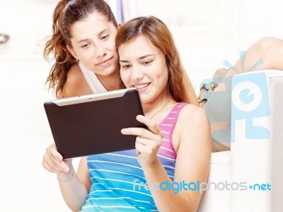 Happy Teenage Girls Using Touchpad Stock Photo