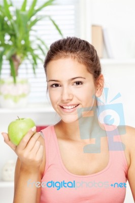 Happy Woman At Home With Fruit Stock Photo