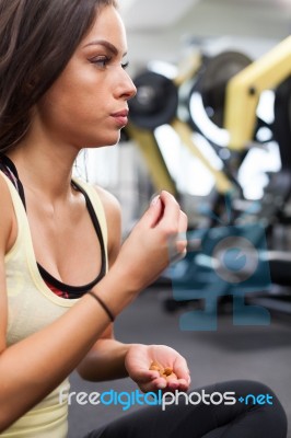 Happy Woman Having A Break From Exercising In Health Club Stock Photo