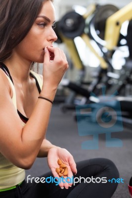 Happy Woman Having A Break From Exercising In Health Club Stock Photo