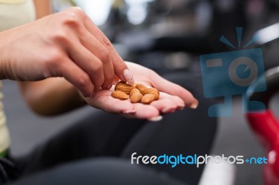 Happy Woman Having A Break From Exercising In Health Club Stock Photo