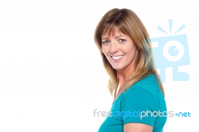 Happy Woman In Casuals Posing Sideways Stock Photo