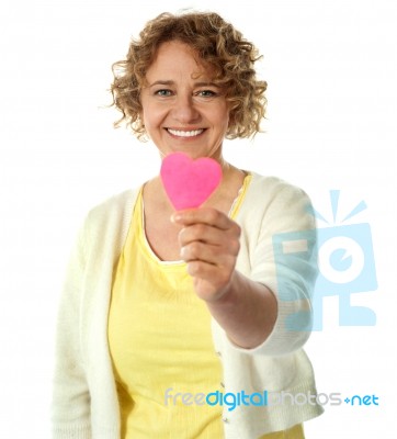 Happy Woman Offering Her Heart Stock Photo