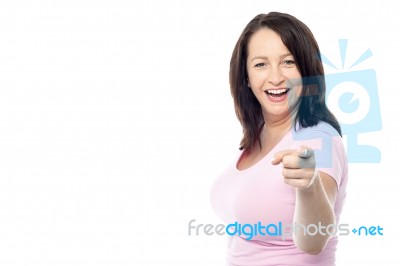 Happy Woman Pointing At The Camera Stock Photo