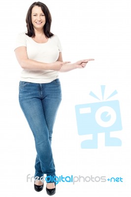 Happy Woman Pointing Copy Space Stock Photo