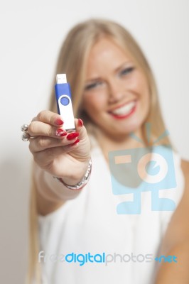 Happy Woman With Usb Memory In Hands Stock Photo