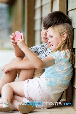 Happy Young Brothers Taking Selfies With Her Smartphone In The P… Stock Photo