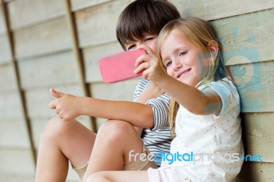 Happy Young Brothers Taking Selfies With Her Smartphone In The P… Stock Photo