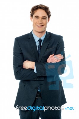 Happy Young Businessman Smiling At The Office Stock Photo