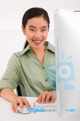 Happy Young Businesswoman Using Computer Stock Photo