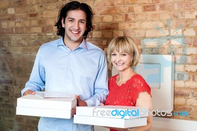 Happy Young Couple With Pizza Boxes Stock Photo