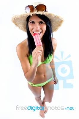 Happy Young Girl In Bikini, Eating An Strawberry Ice Cream Stock Photo