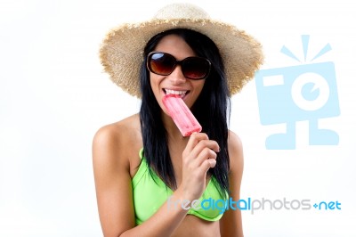 Happy Young Girl In Bikini, Eating An Strawberry Ice Cream Stock Photo