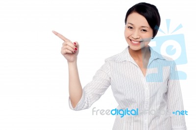 Happy Young Girl Pointing At Copy Space Area Stock Photo