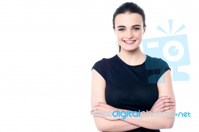 Happy Young Girl Posing, Arms Crossed Stock Photo