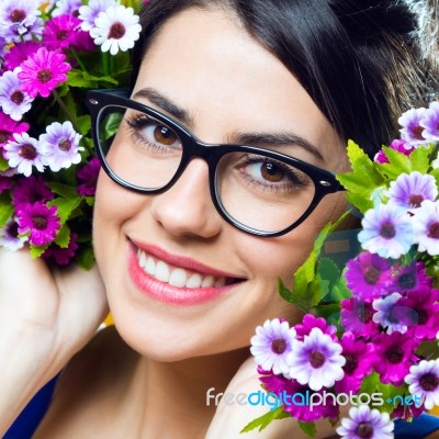 Happy Young Girl With Flowers Stock Photo