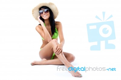 Happy Young Girl With Green Bikini Talking On Mobil Phone Stock Photo